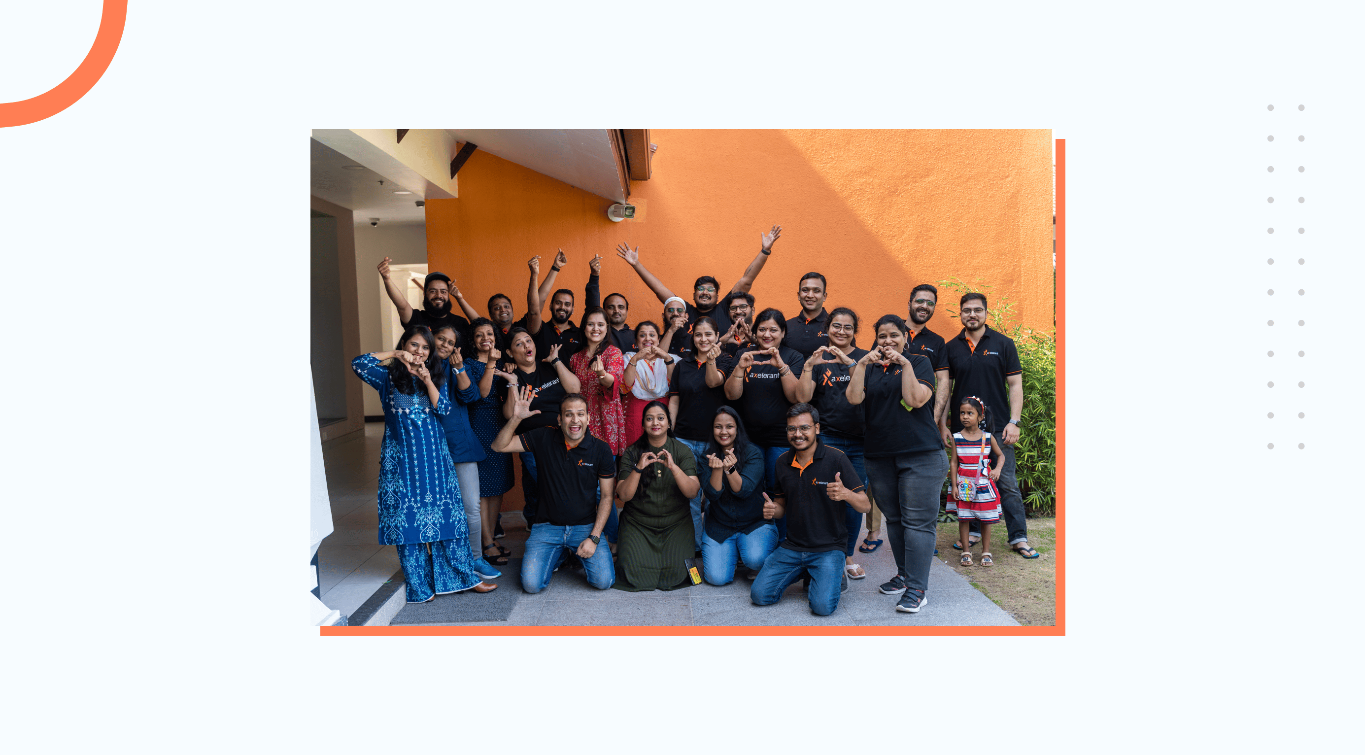 A group of team members happily posing for a picture