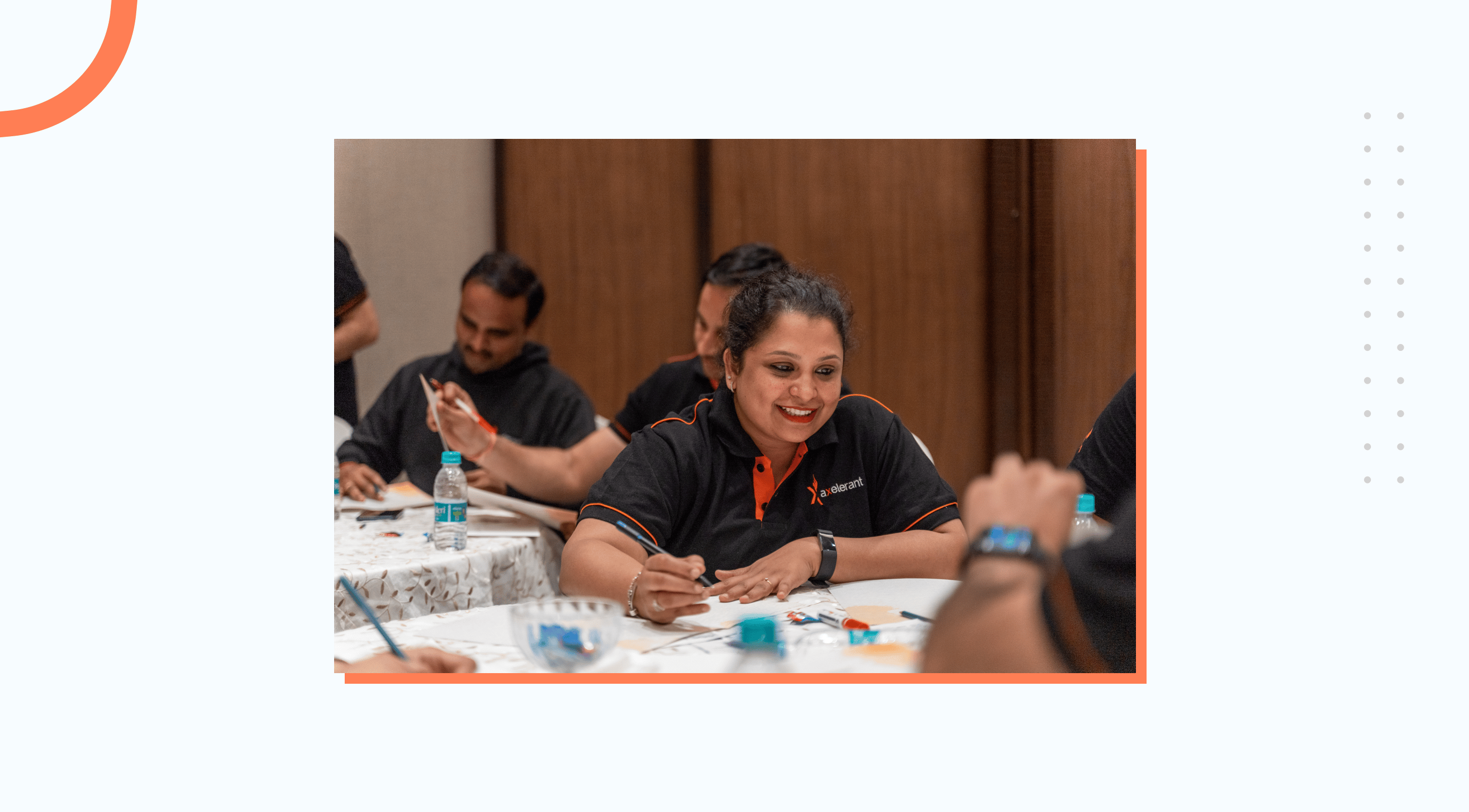 Manjula working with a smile on her face