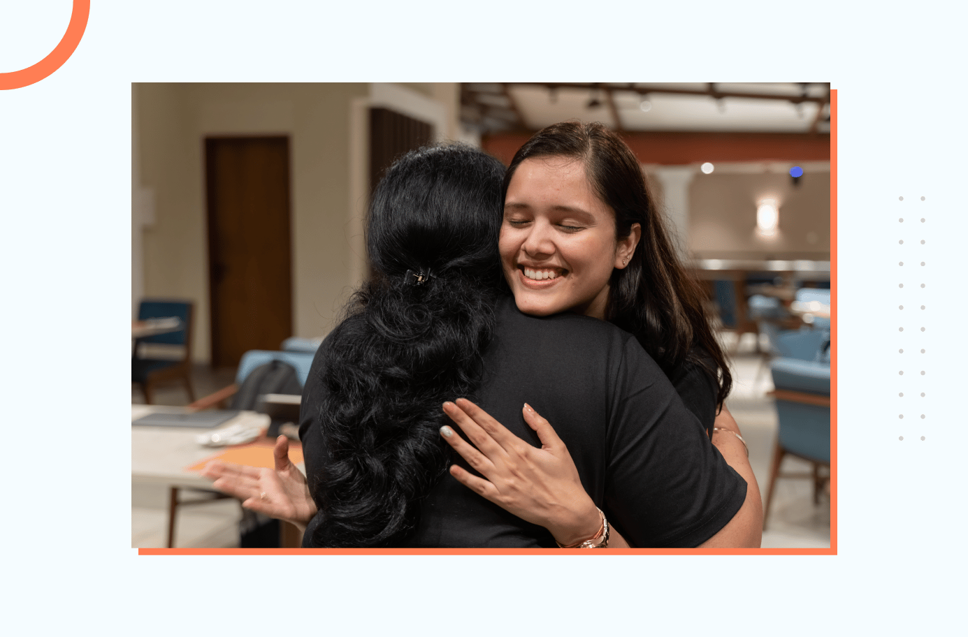 Two team members bonding through warm embrace